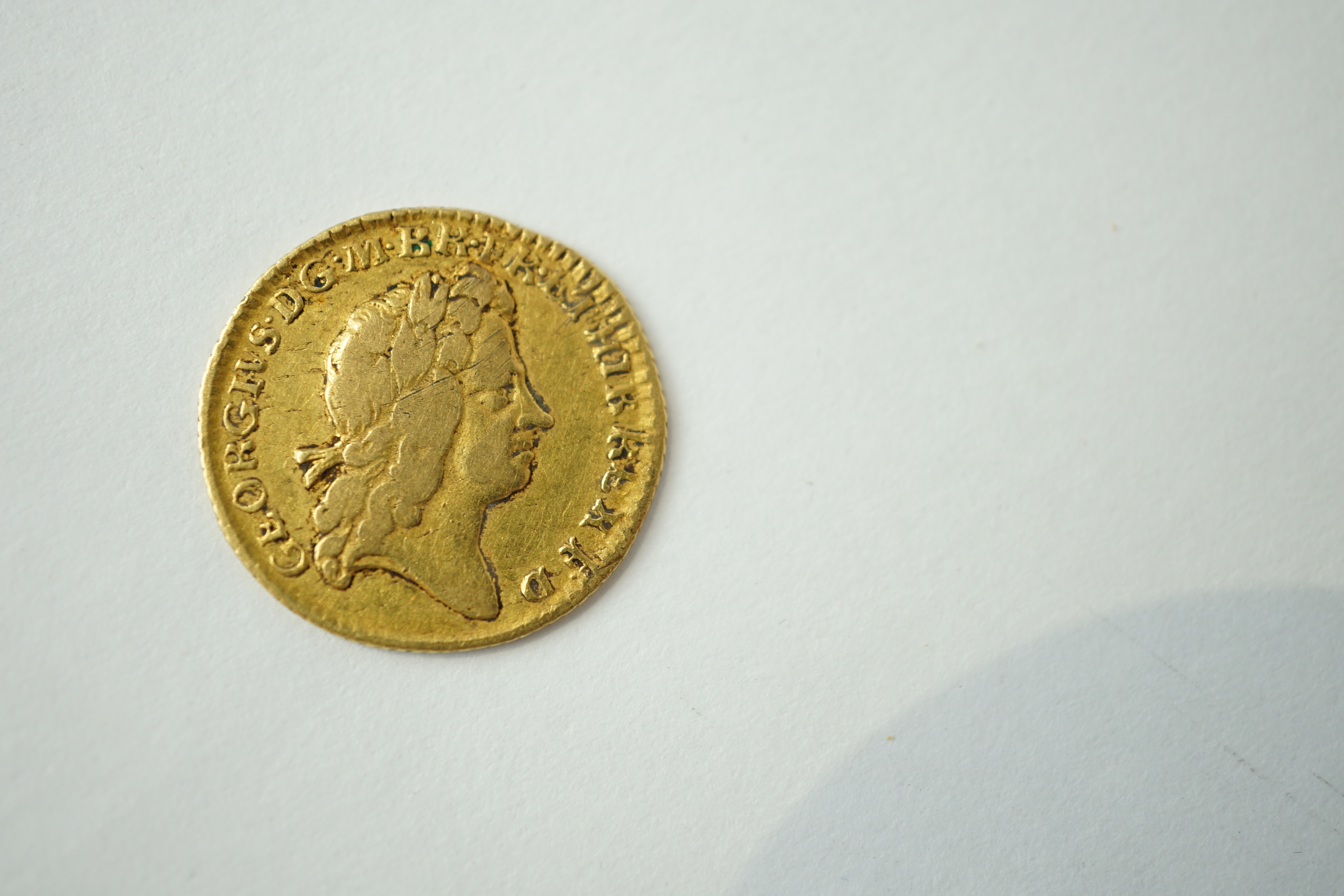 British gold coins, George I half guinea, 1725, possibly demounted at 1 o’clock otherwise fine or better
